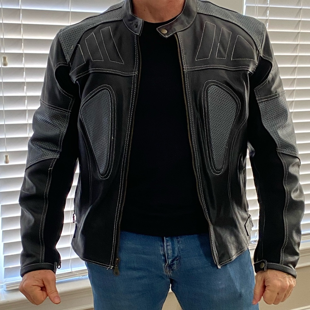 Real Leather motorcycle jacket, with zip liner, and removable pads. Barely worn.